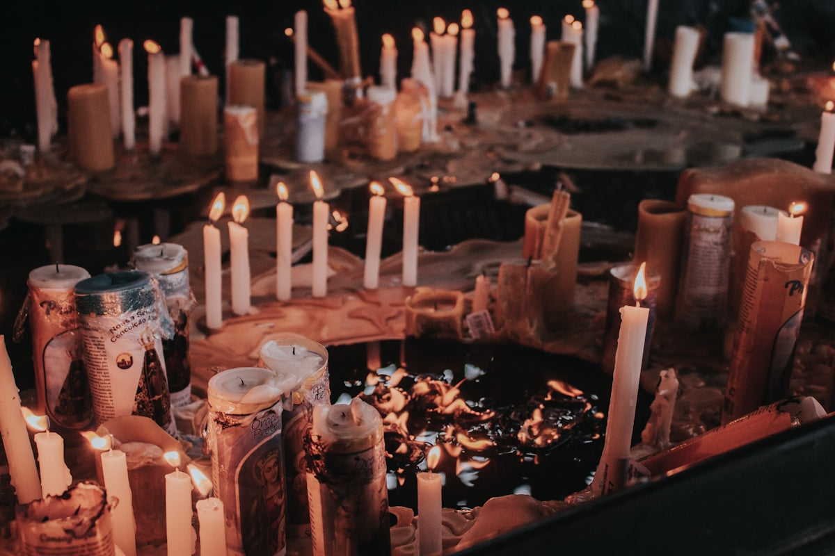 a bunch of candles that are on a table